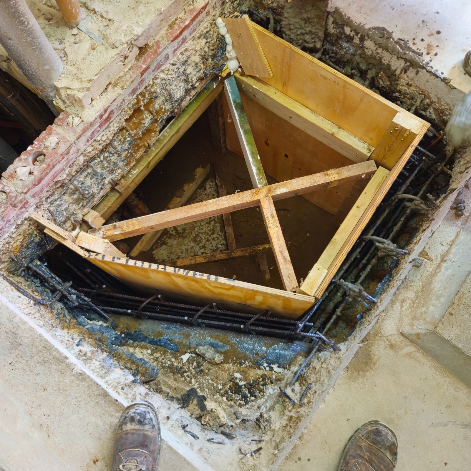 Reinforcement and timber shuttering for the inspection pit walls in Guildford
